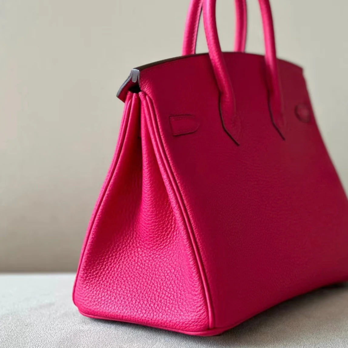 Sac à main en cuir rose fushia avec cadenas – maison mathurine